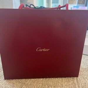 Cartier bag with sample perfumes, bracelet/watch pillow and case.